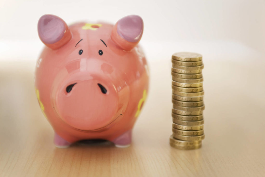 piggy bank and stack of coins