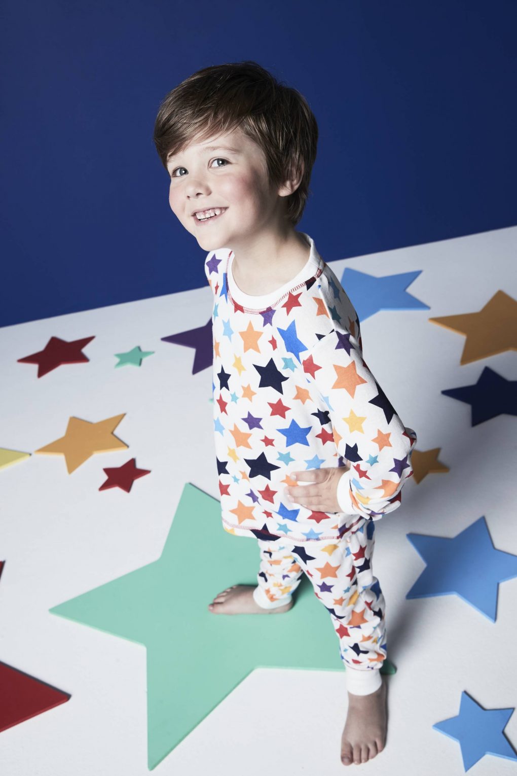 boy in star pyjamas