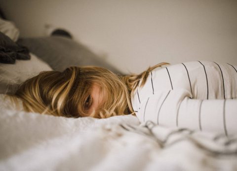 pregnant woman sleeping in bed