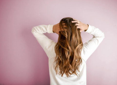 woman with shiny hair after using MCT oil